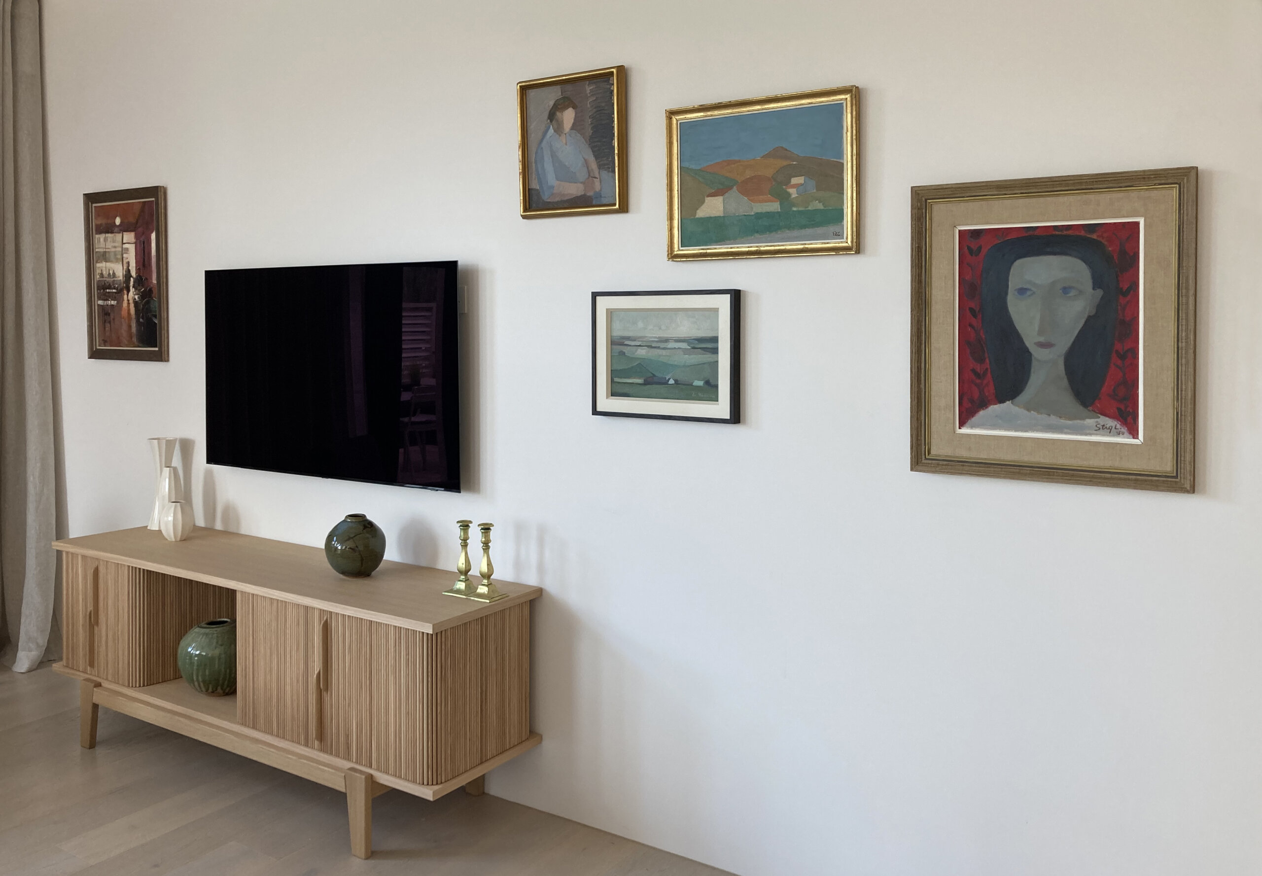 TV wall with paintings